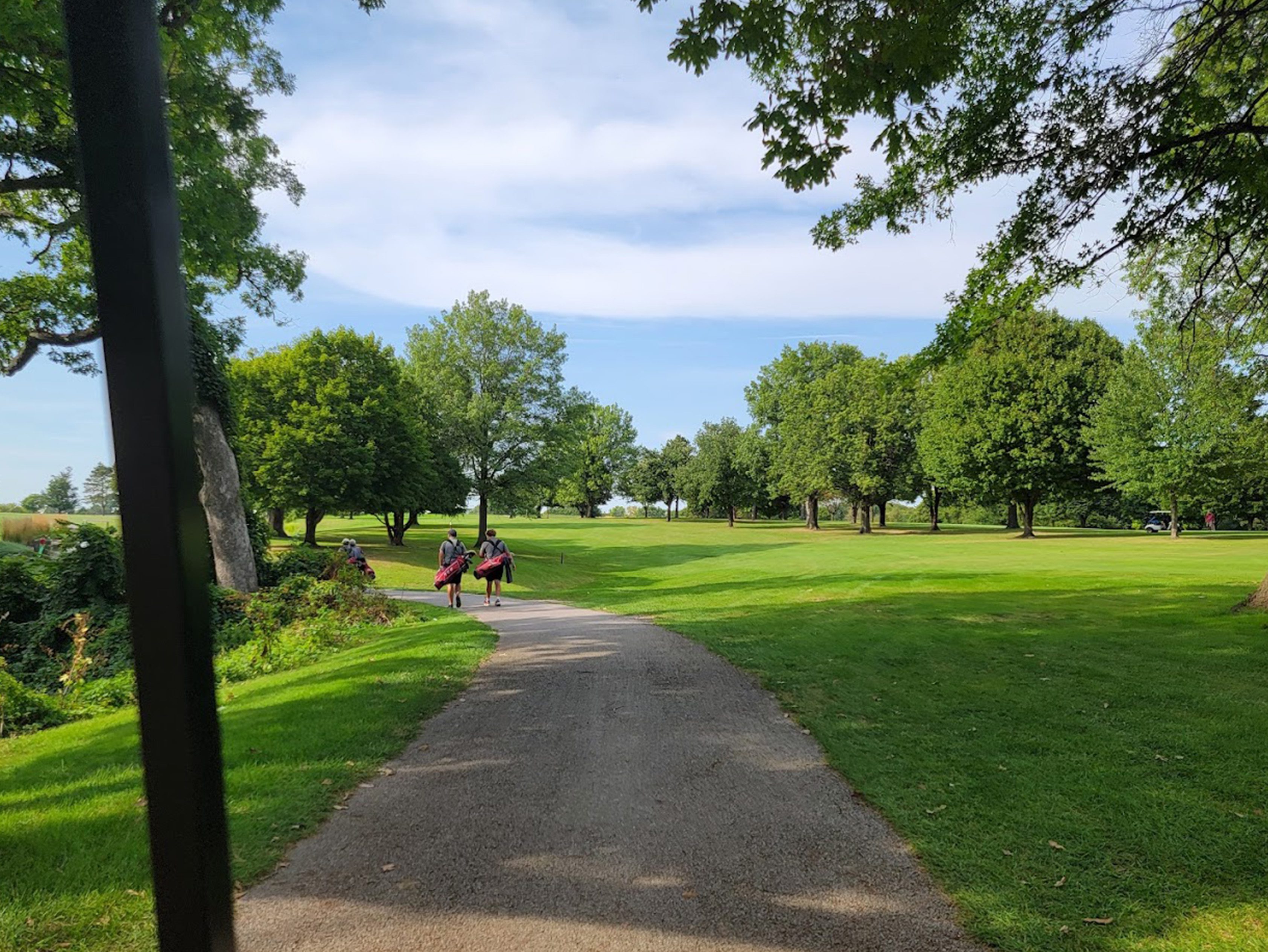 Landscape view of Newman Golf Course with fairway and green